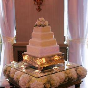 fwthumbShow stopper cake table with sitting on a bed of flowers. Oulton Hall.jpg